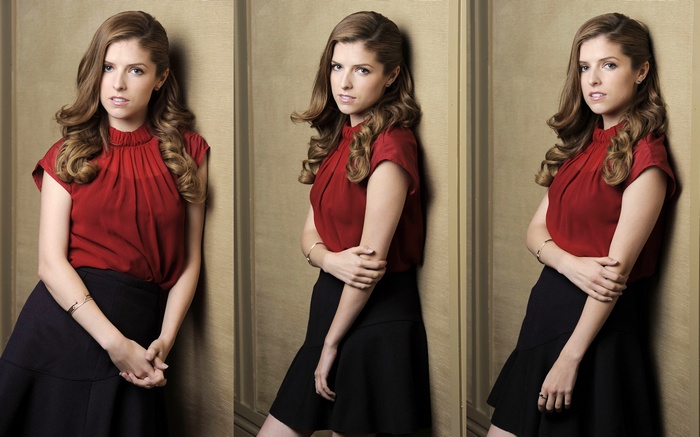 Anna Kendrick in red top and black skirt