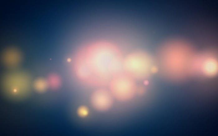 Abstract bokeh lights on dark blue background
