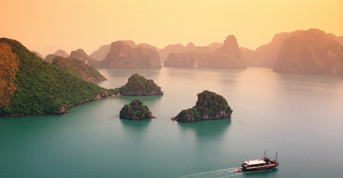 Halong Bay, Vietnam with limestone islands and a boat