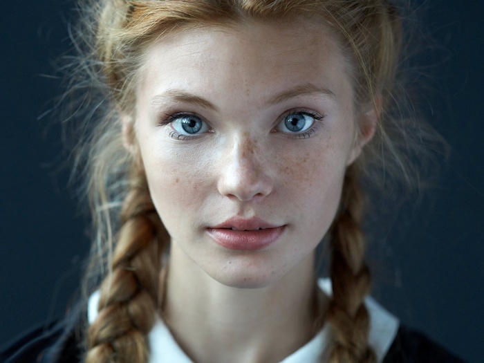 Portrait of Dasha Milko with blue eyes and freckles
