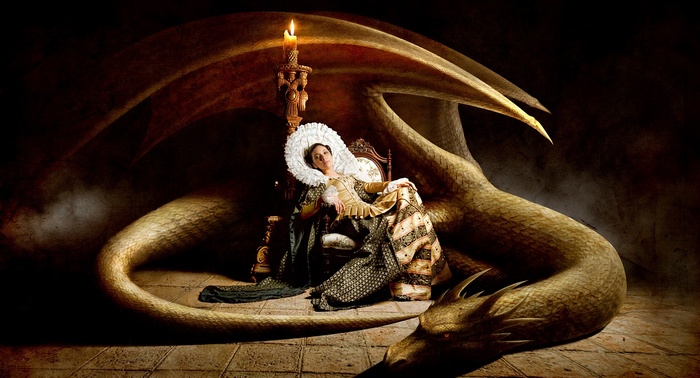 Woman in ornate dress with a dragon