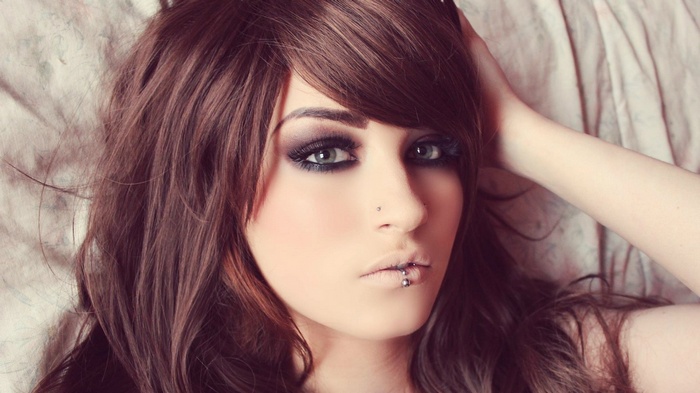 Niky Von Macabre with green eyes and piercings