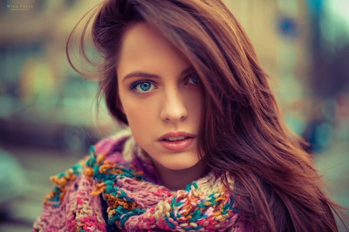 Woman with blue eyes and colorful scarf