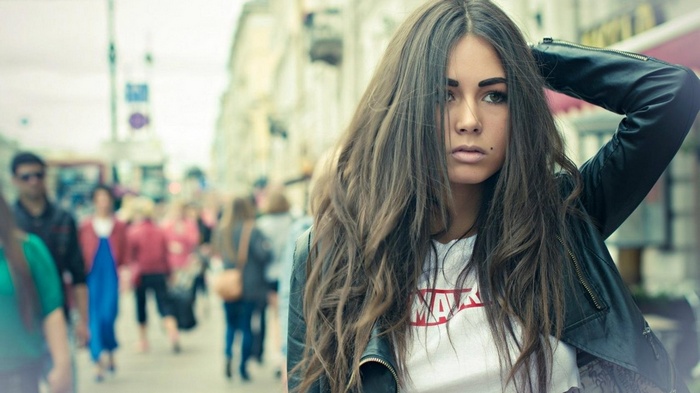 Diana Melison with long hair in an urban setting