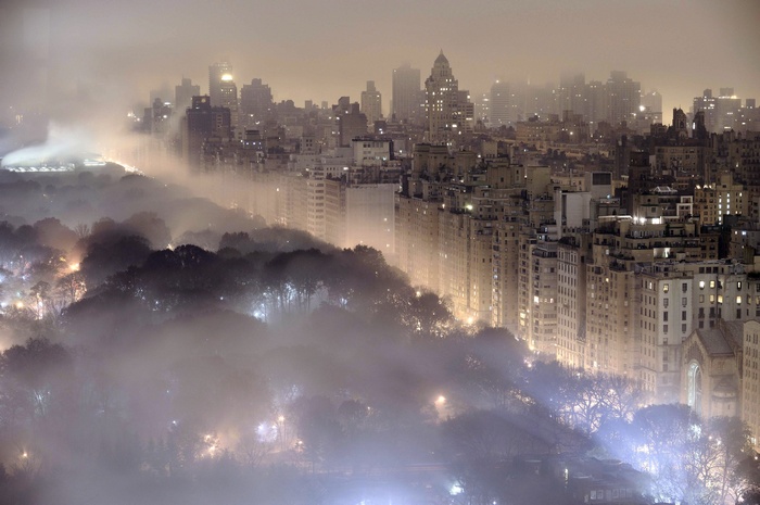 New York City skyline shrouded in mist at night