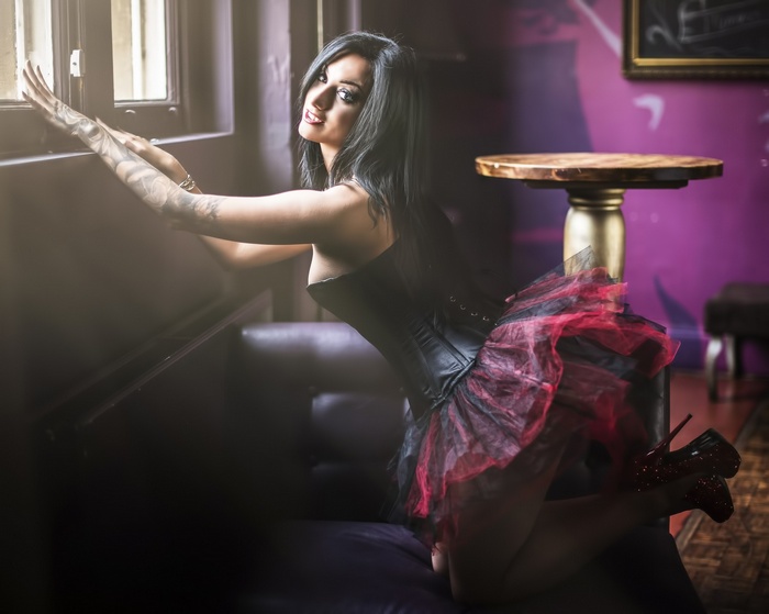 Woman with tattoos wearing a corset and tutu