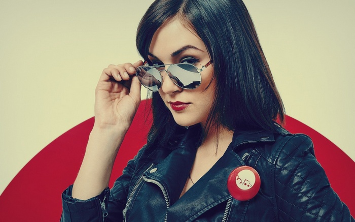 Sasha Grey wearing sunglasses and a leather jacket