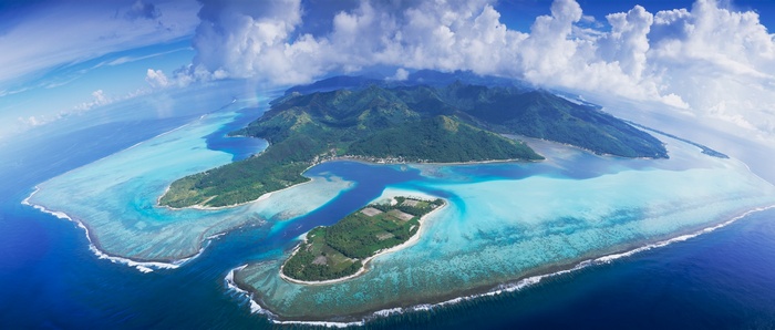 Aerial view of Bora Bora with turquoise lagoons and mountains