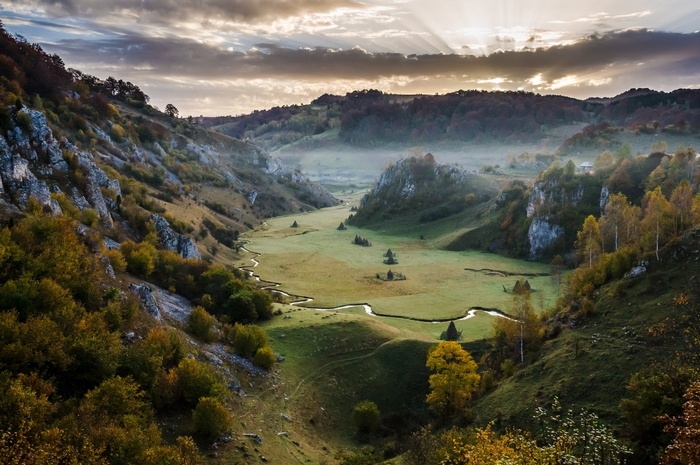 Misty Valley with Sun Rays in Romania