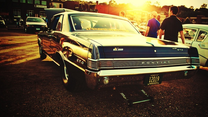 Pontiac GTO muscle car at sunset