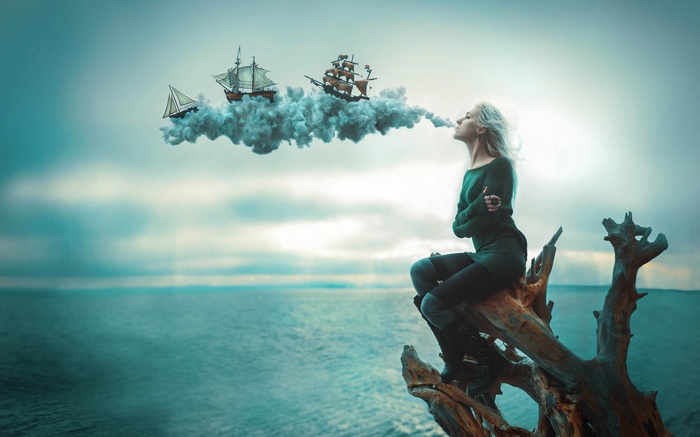 Woman exhales clouds with sailing ships