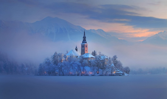 Church on an island in Lake Bled during winter