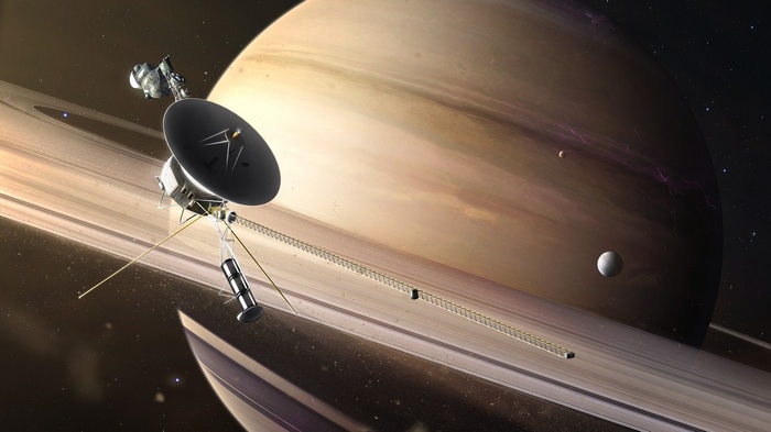 Voyager spacecraft near Saturn and its rings