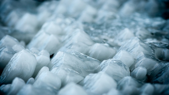 Close-up of ice chunks with water