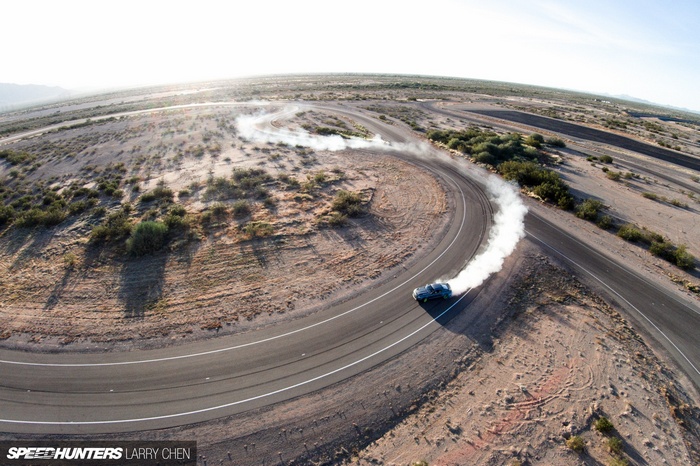 Ford Mustang drifting on a desert race track