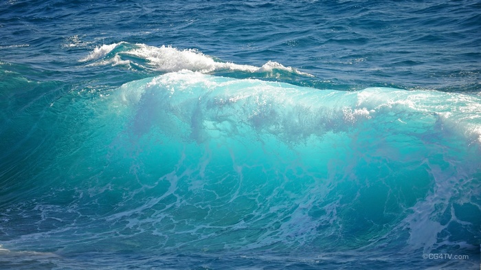 Turquoise ocean wave crashing with white foam