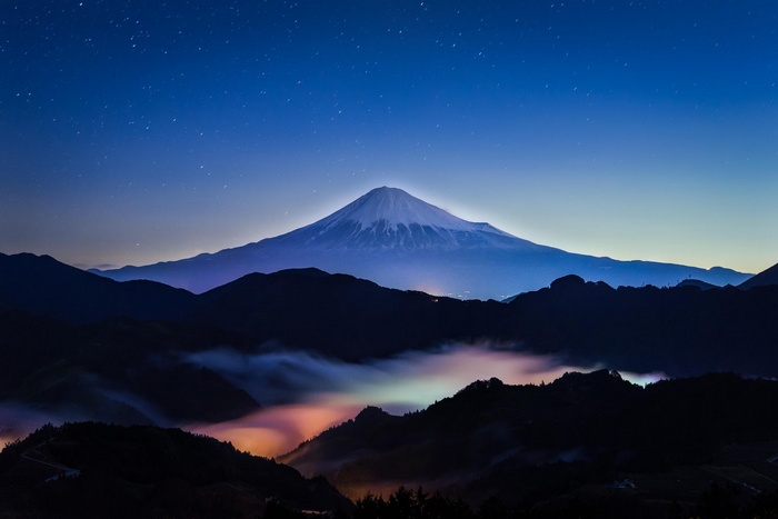 Mount Fuji at night with stars and fog