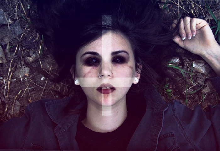 Woman with black eyes and satanic cross overlay