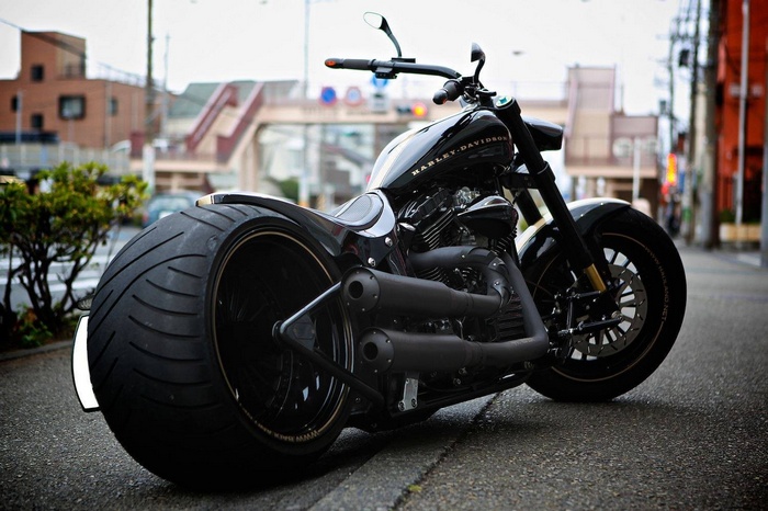 Black Harley-Davidson motorcycle parked on a street
