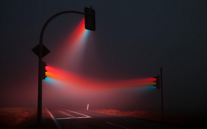 Traffic lights in mist at night