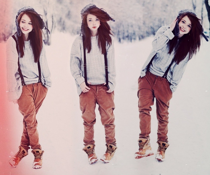 Redhead girl in winter clothes with suspenders