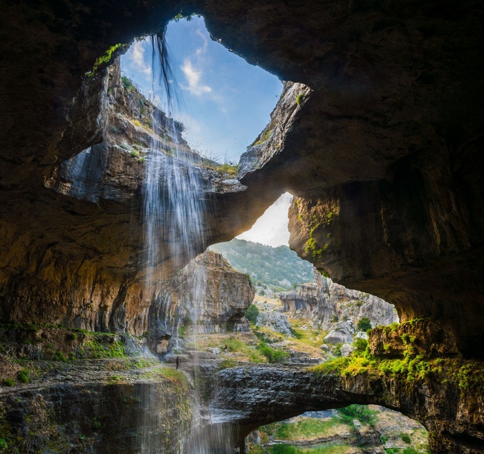 Waterfall cascading through a cave in Lebanon