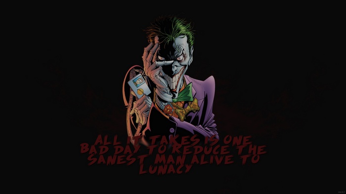 The Joker holding a card with a quote