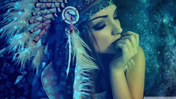 Melanie Iglesias wearing a Native American headdress