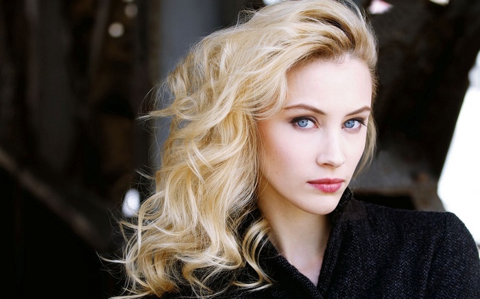 Sarah Gadon with blonde hair and blue eyes