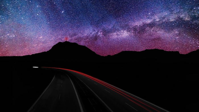 Highway under the Milky Way and stars