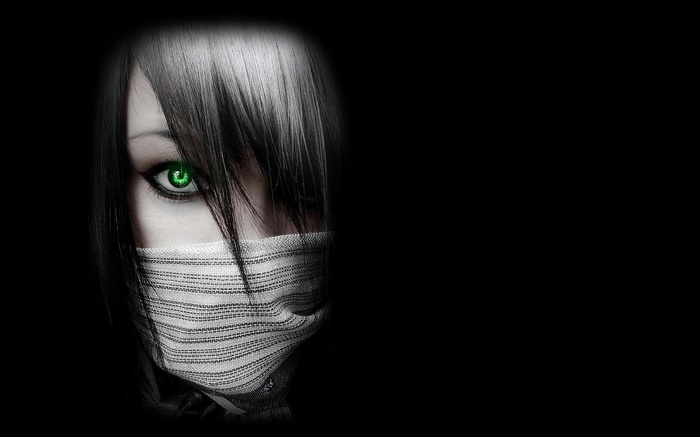 Woman with green eyes and face mask