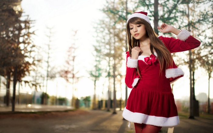 Woman in Santa Costume Standing Outdoors