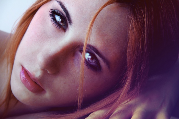 Close-up of a redhead woman with makeup