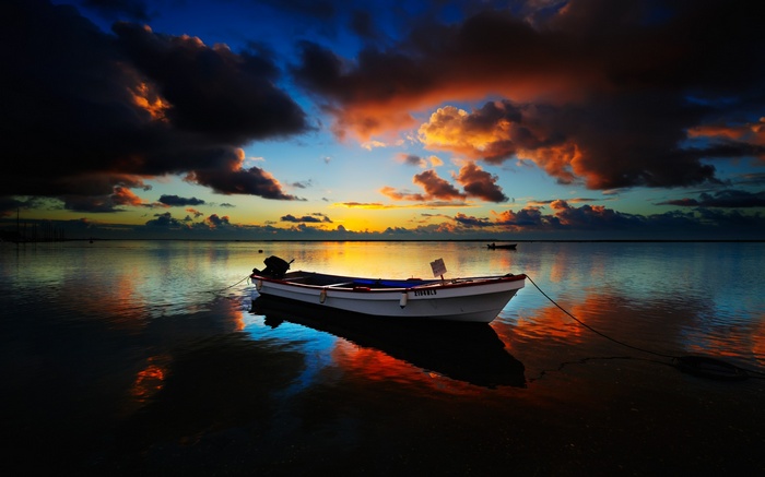 Boat on the water at sunset