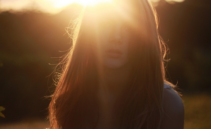 Woman with long hair in sunlight