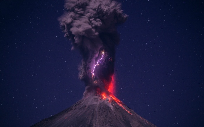 Volcano eruption with lightning at night