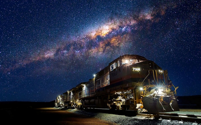 Diesel locomotive under the Milky Way at night