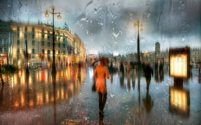 Rainy St. Petersburg street with people and reflections