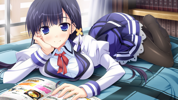Anime schoolgirl lying on a bed reading a magazine