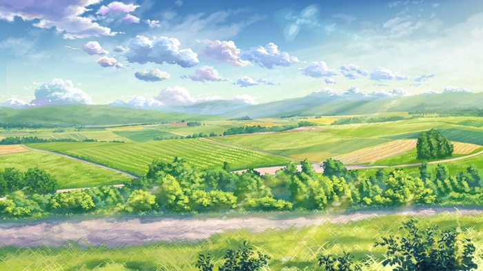 Sunlight over rolling green fields and clouds