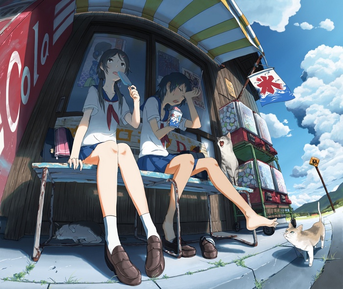 Two schoolgirls eating ice cream outside a store with cats