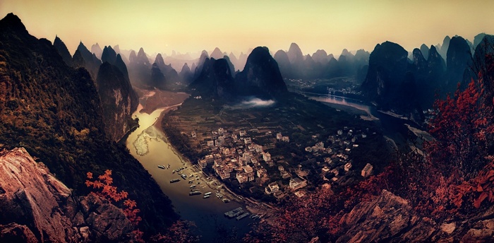 Karst mountains and river in China at sunset