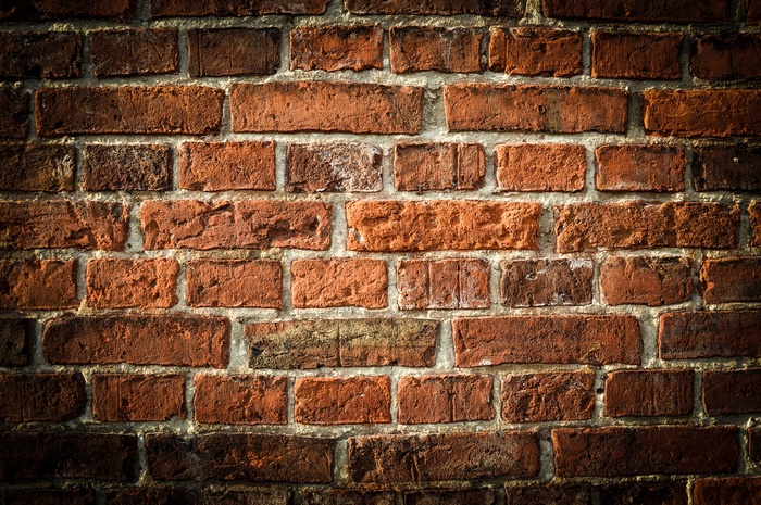 Close-up of a weathered brick wall texture