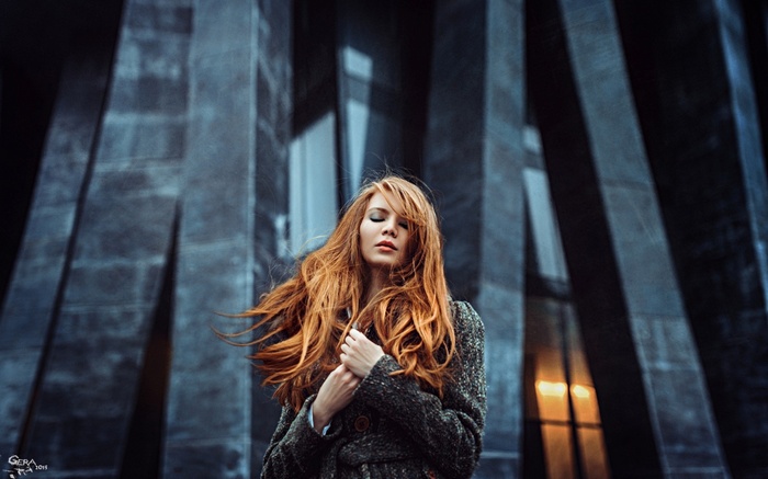Antonina Bragina with long red hair outdoors