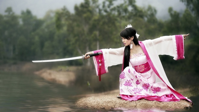 Asian woman in traditional Japanese attire with a katana