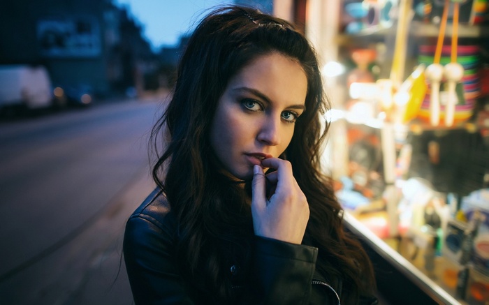 Aurela Skandaj with finger in mouth outdoors