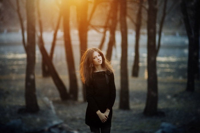 Model Ksenia Malinina in a black dress outdoors