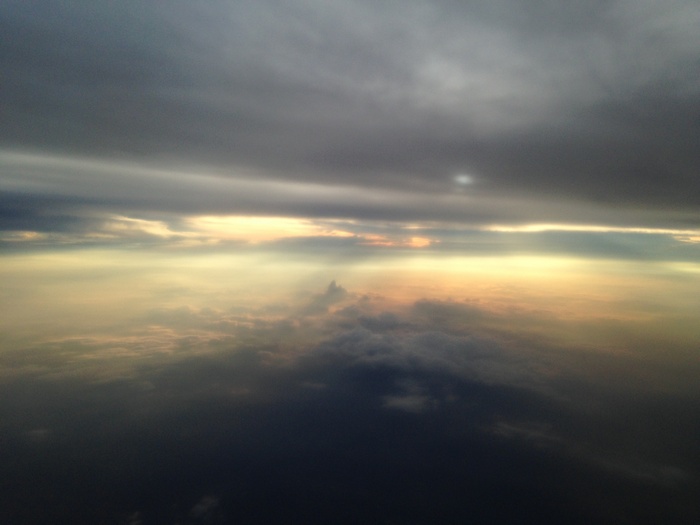 Clouds and sky from an airplane window