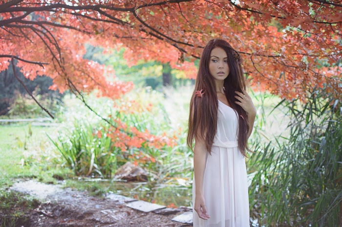 Woman in white dress in autumn nature