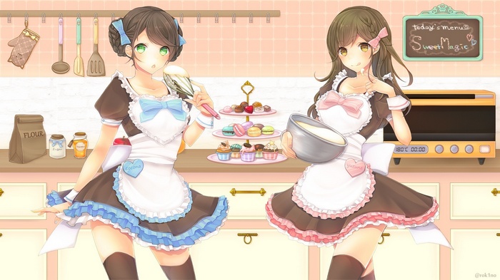 Two maids baking cakes in a kitchen